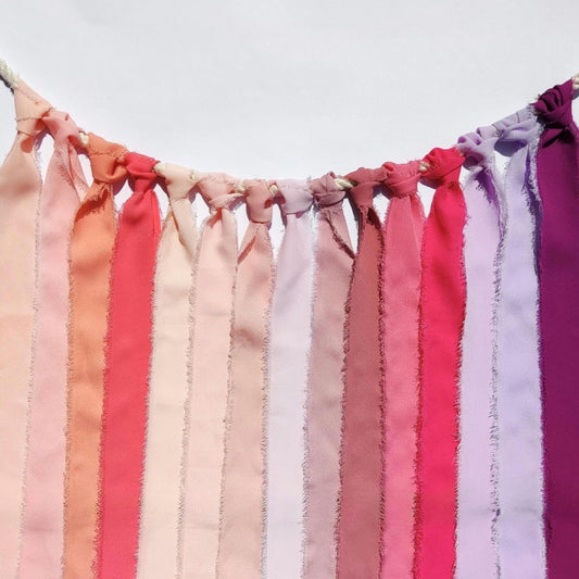 Floaty frayed edge chiffon ribbon in various pink shades, such as baby pink, soft pink, rose pink, salmon pink, coral pink, dusty pink, bubblegum, hot pink, lilac, magenta. 38mm width.